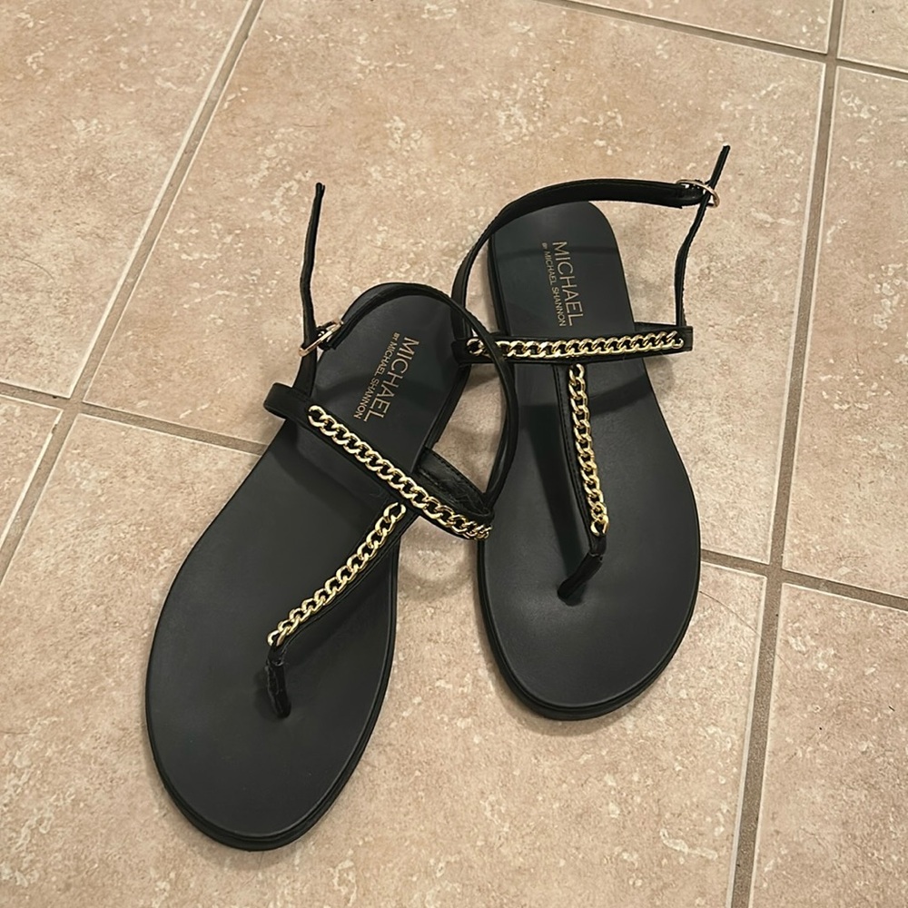 Black flat sandals with chain detail. Back strap. Size 10